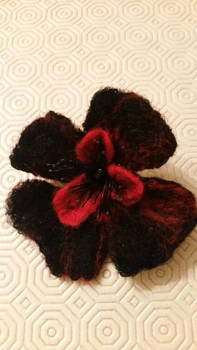 Black and red felt flower