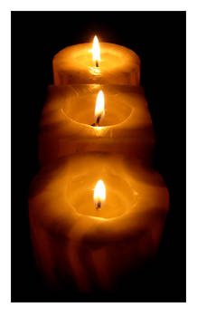 three candles burning