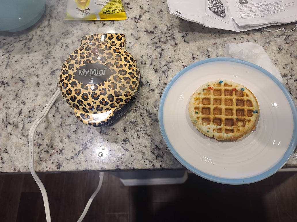 Using my mini waffle maker for the first time by ElaineWolfDraws on