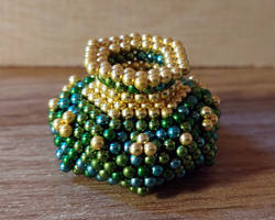 Magnetic green and gold urn