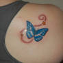 Blue butterfly tattoo.