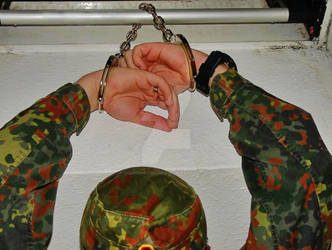 Helpless uniform-boy handcuffed to skylight. by SneakerBoyBondage