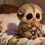 Kukang Hugging a Stuffed Animal