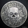 Hand Engraved Skull Scrolls Coin by Shaun Hughes