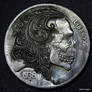 Scrollman Skull Coin Carving by Shaun Hughes