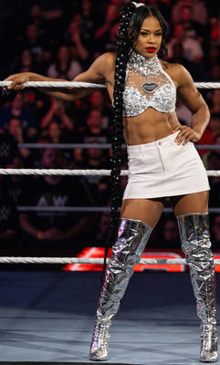 Bianca Belair Posing in her Sexy Mini White Skirt