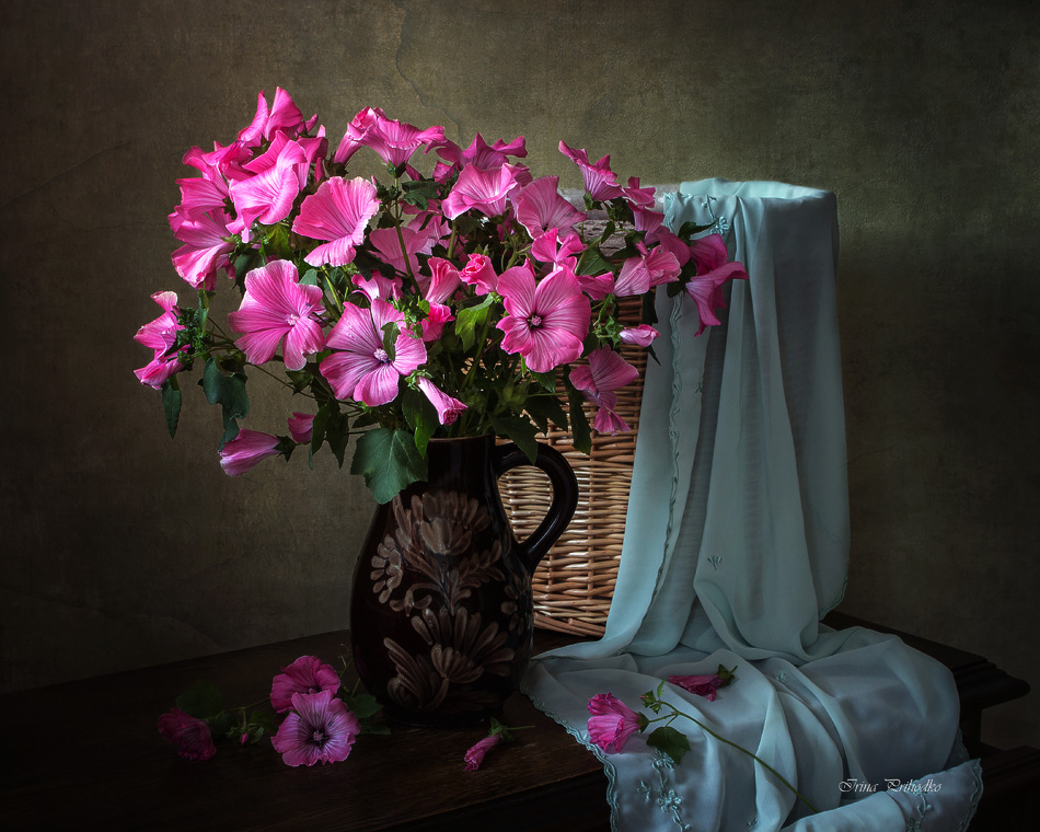 Still life with pink hollyhocks