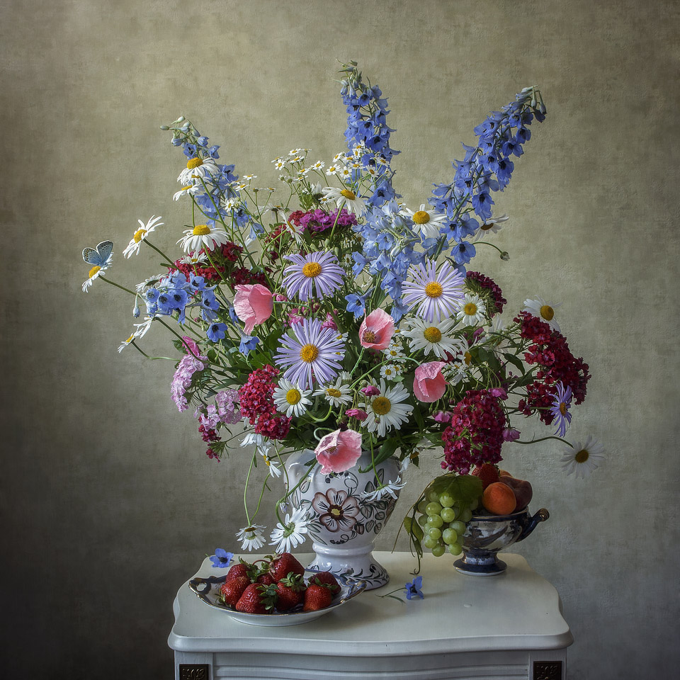 Still life with garden flowers and fruits