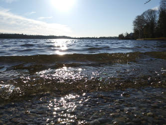 Lake Waves Flowing to Rocky Shore