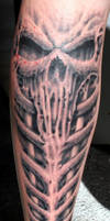 bio skull leg tattoo