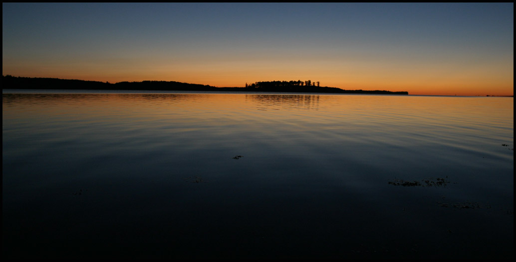 Sunrise over placid waters