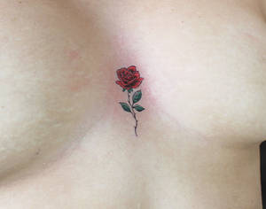 Tiny rose sternum tattoo