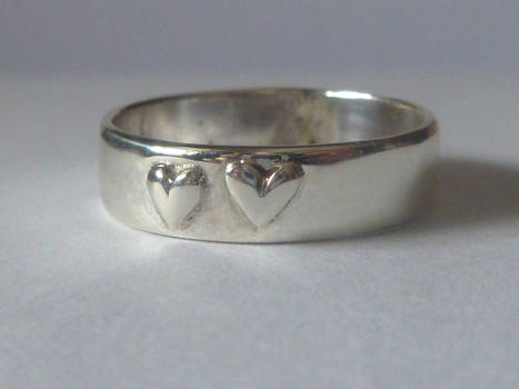 Silver ring with hearts