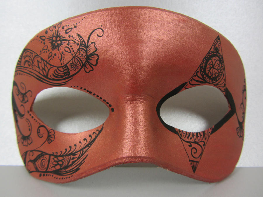 Intricate copper colored mask