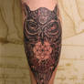 Owl tattoo with hamza and sacred geometry