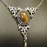 framed persian tigers eye in silver necklace