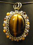 orbit tigers eye pendant by BacktoEarthCreations