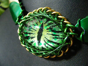 Green dragon eye with scales