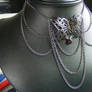 Gunmetal Butterfly with chain Drapes and garnet