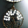 Howlite round leaves in bronze circle and bark