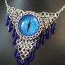 Acid Blue Eye In Chainmaille With Blue Daggers