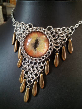 Bronzed fire eye in chainmaille with bronze dagger