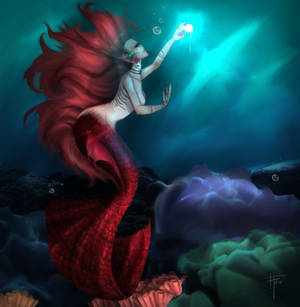 Red mermaid in a blue ocean.