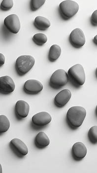 Group Of Rocks On Top Of A White Surface