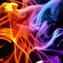 Different Colored Smokes On A Black Background
