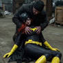 Batgirl in the arms of a thug