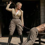 Hilde the disciplinarian in Steinbergs is whipping a prizoner