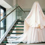 the bride was covered with a satin sheet