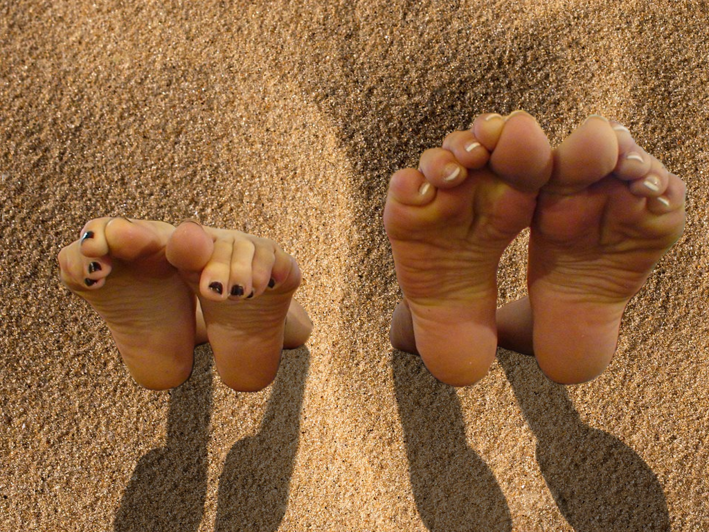 Mother and Daughther Headfirst in the Sand