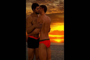 Chris and Piers Kissing at sunset (Nivanfield)