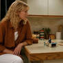 Women talking to miniature man