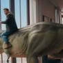 Guy rides tyrannosaurus in apartment. Ai video
