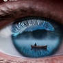 Fisherman in a wooden boat on lake. Inside the eye