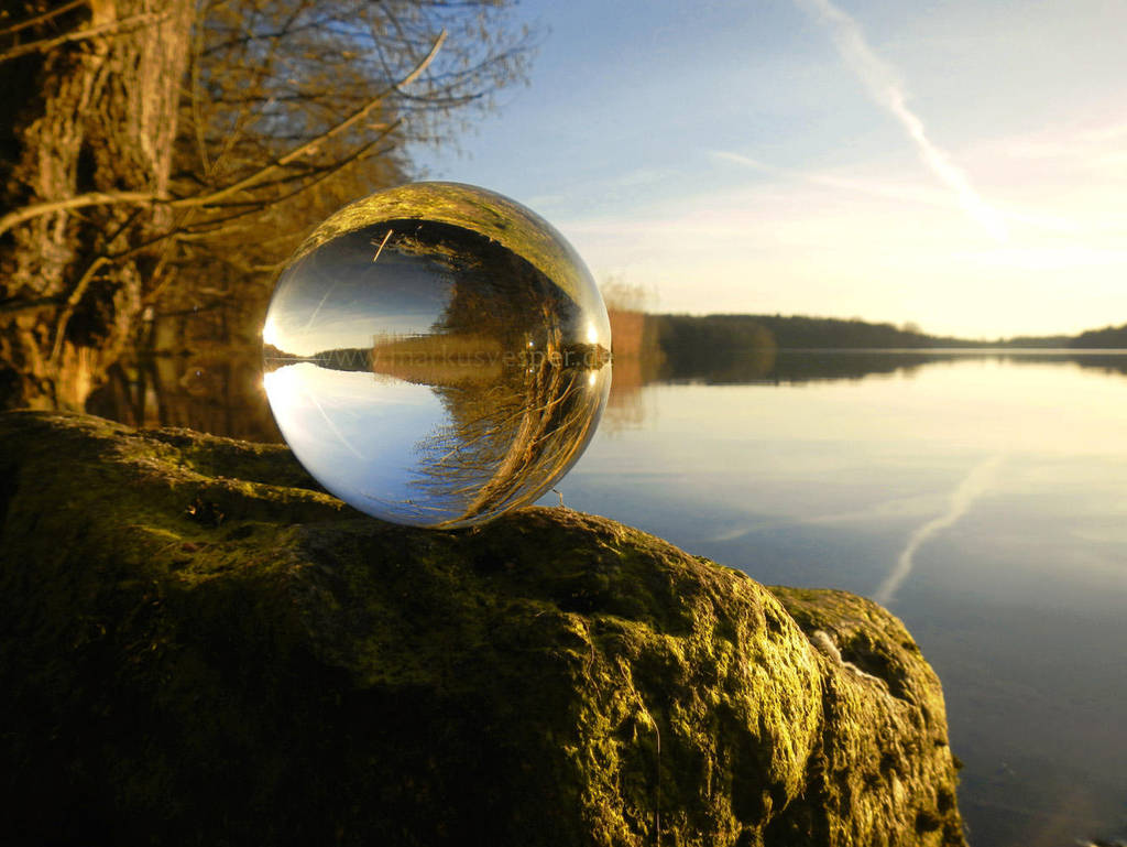 Glass sphere at the lake at sunset by Acrylicdreams