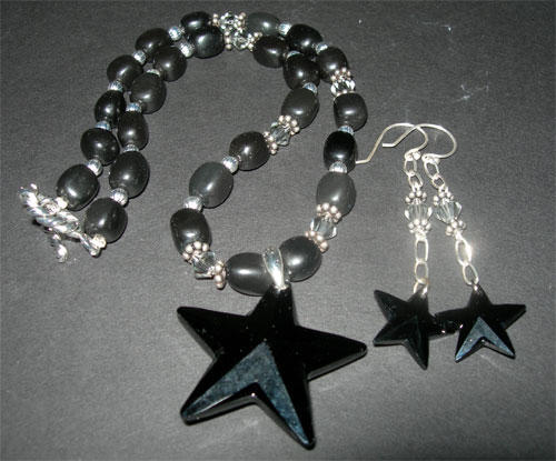 Black Star Necklace by fieryfae
