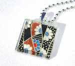 Black brown blue glass pendant by inchworm