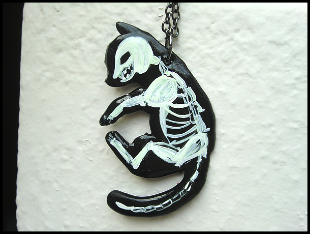GLOWING cat skeleton necklace by GrandmaThunderpants
