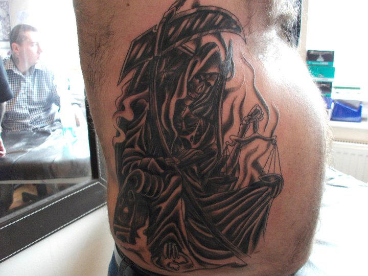 grim reaper rib tattoos