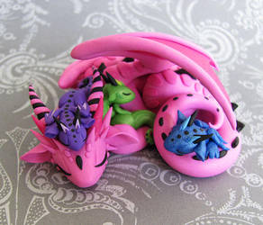 Mama Dragon with Three Babies by DragonsAndBeasties