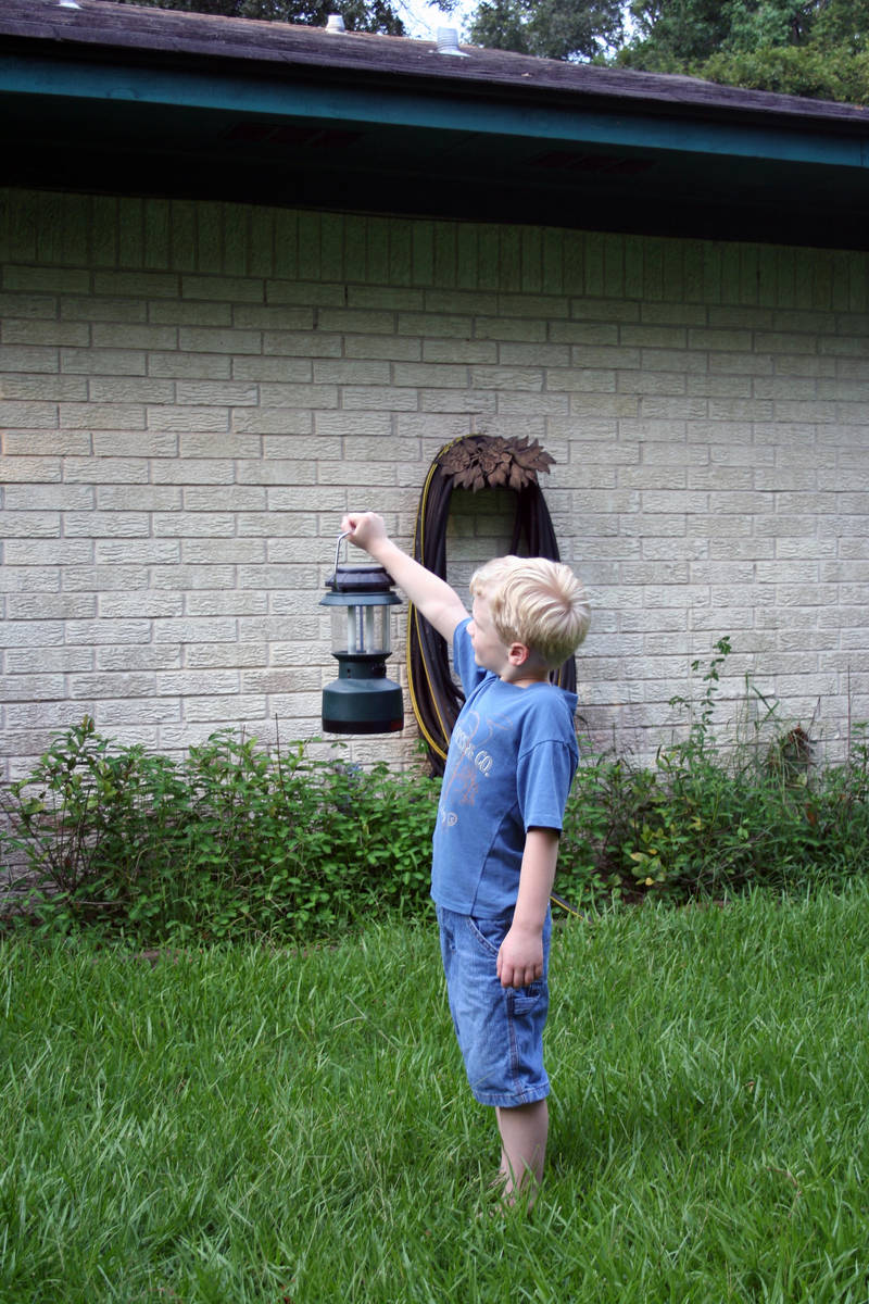 Boy with lantern by goodiebagstock
