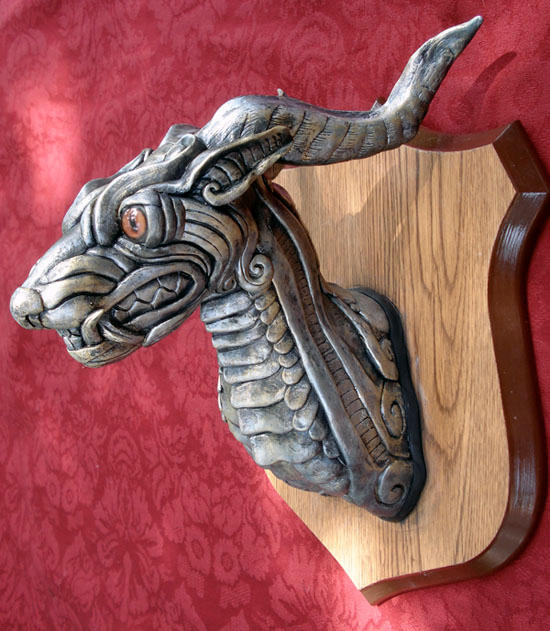 Silver creature head by missmonster