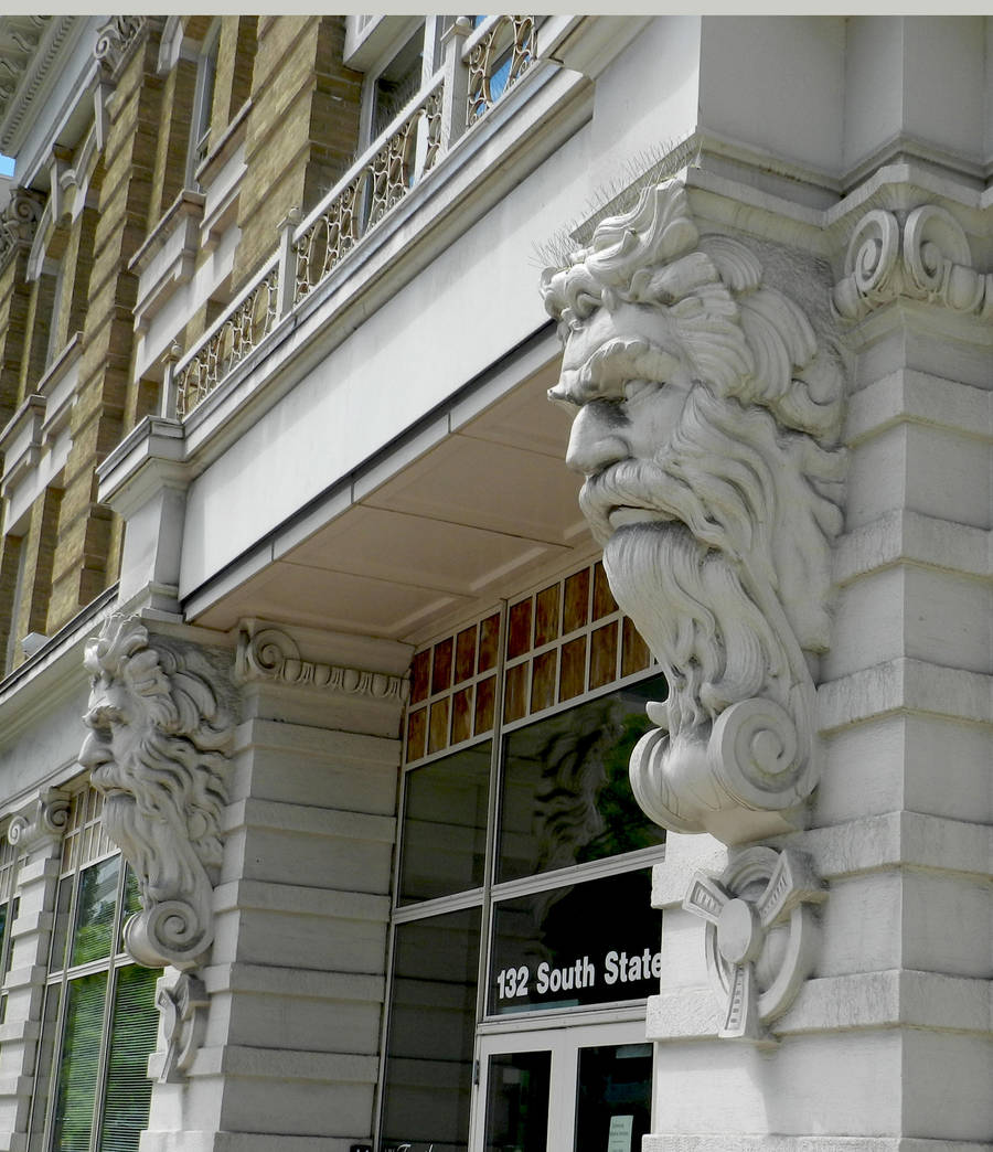 Carved Stone Men on Building in SLC - sideview by EveyD