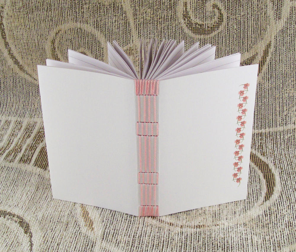 pink stitches, lined journal by yatsu