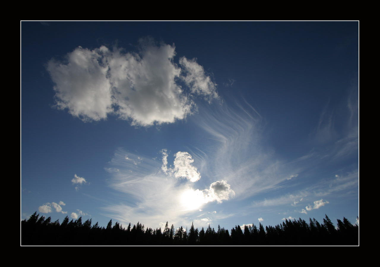 Blue sky, wisps of clouds by zironjones