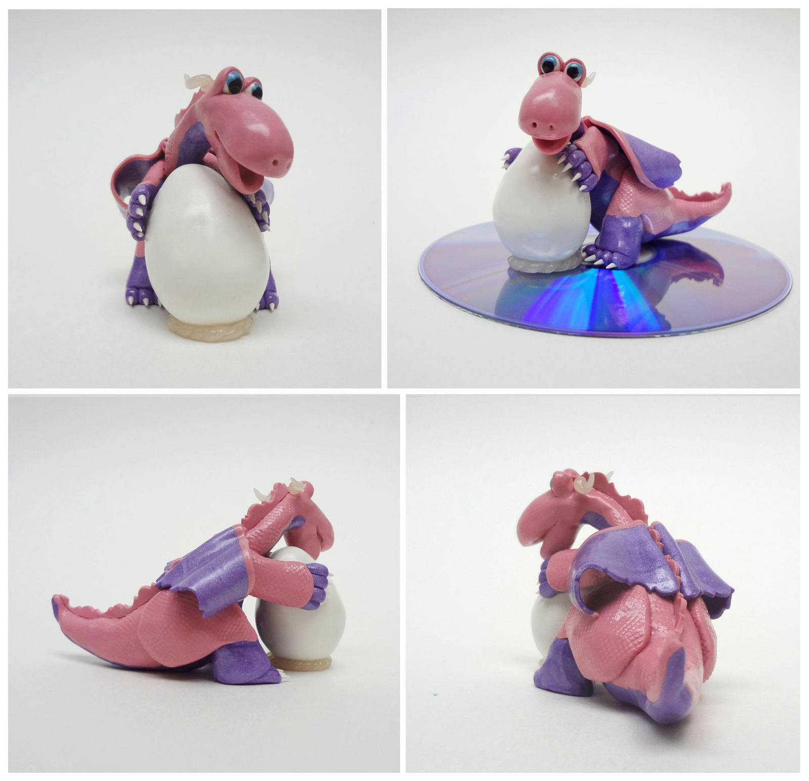 Pink and purple dragon with egg by Koreena