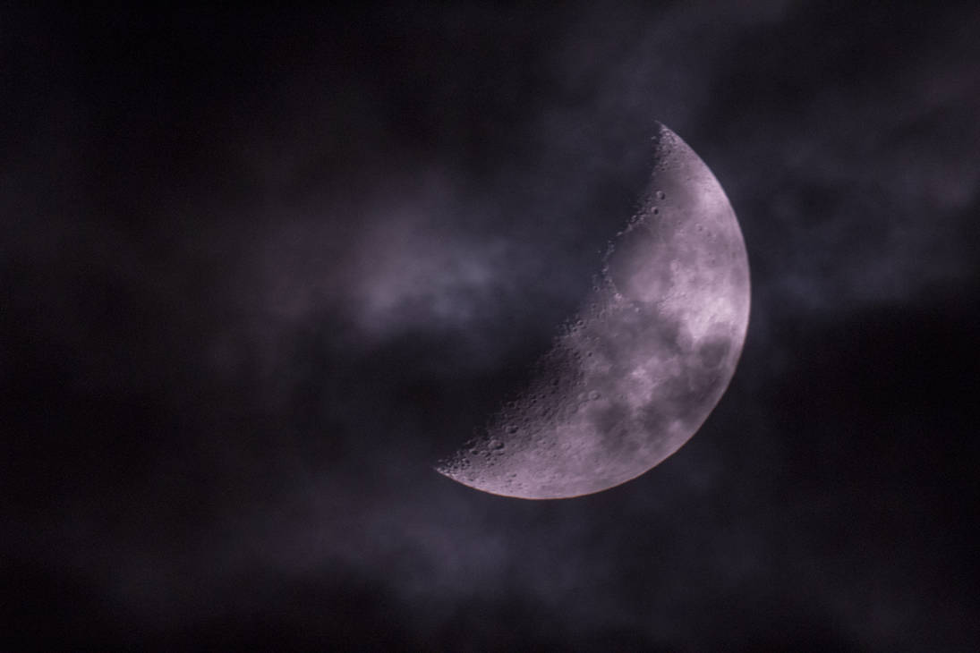 Moon photography through a window and a telescope with cloudy weather